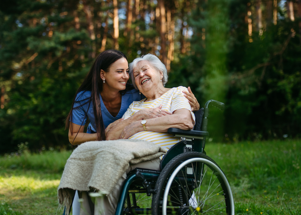 A carer supporting a client outdoors